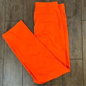 Fila Sport bright orange golf pants. 100% polyester, size 32 (medium).